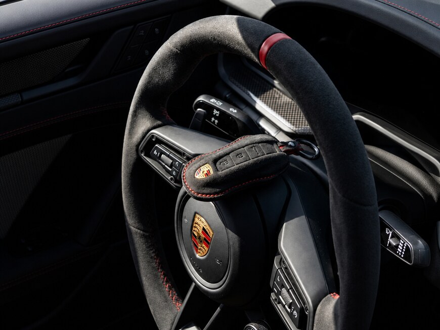 porsche key and steering wheel